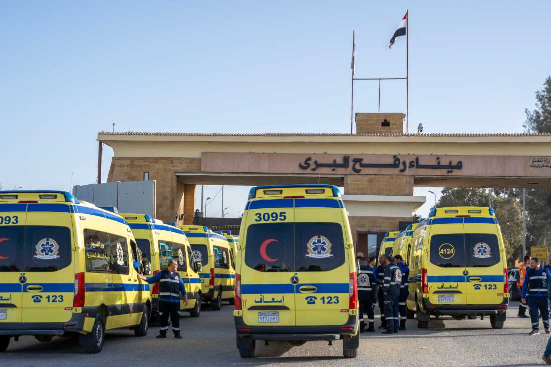 Ambulances line up to enter the Egyptian gate of the Rafah crossing on the way to the Gaza Strip, in Rafah, Egypt, Sunday, Feb. 1, 2026.