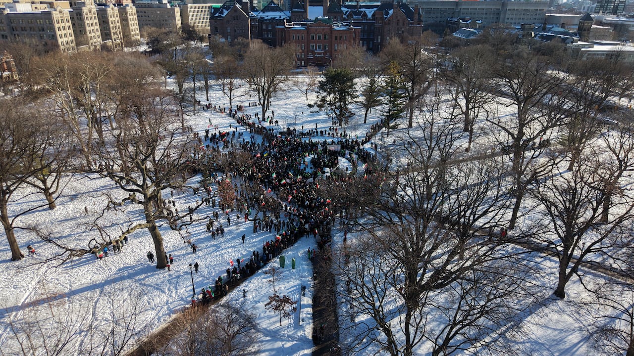 Drone photo of large crowd of people near Queen's Park in Toronto