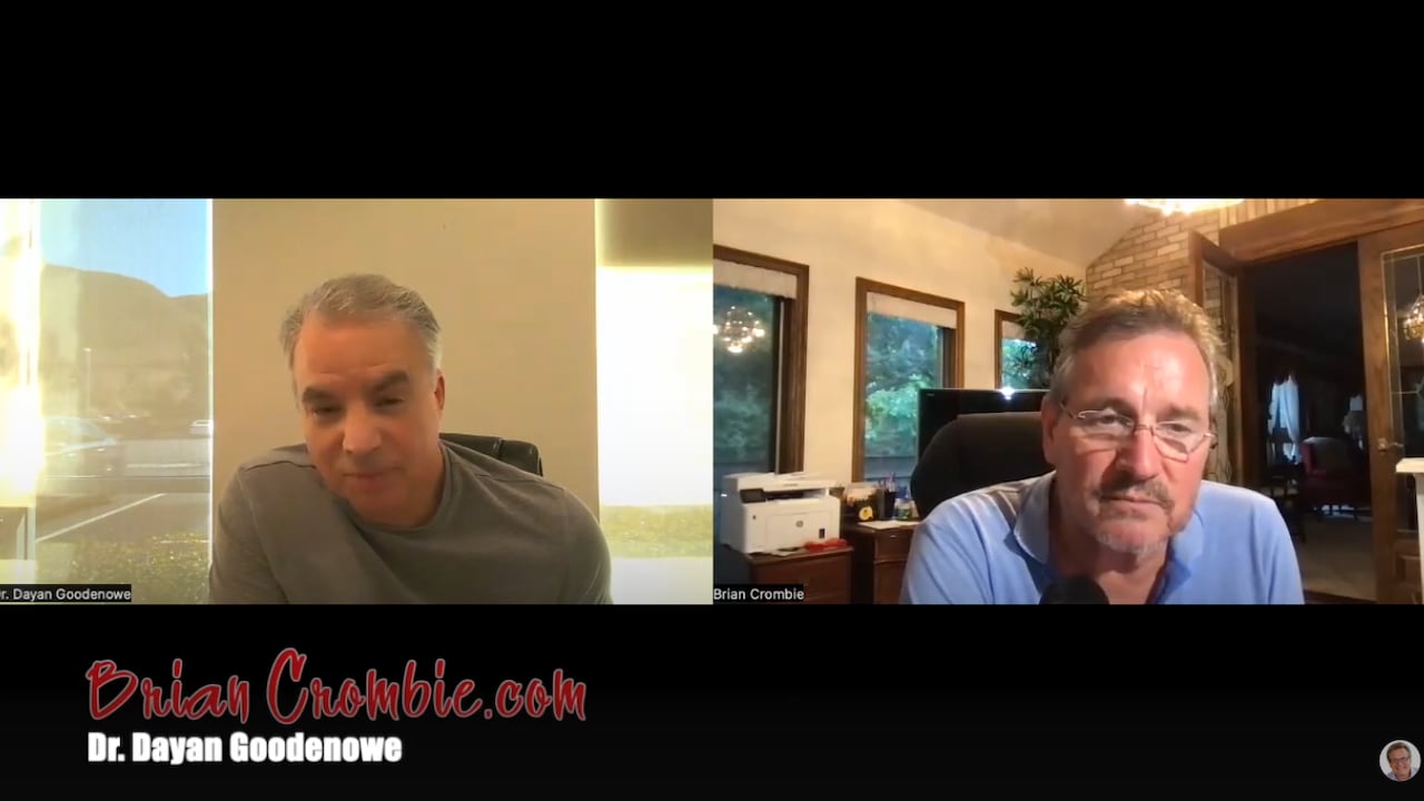 Two men speak to each other via video chat