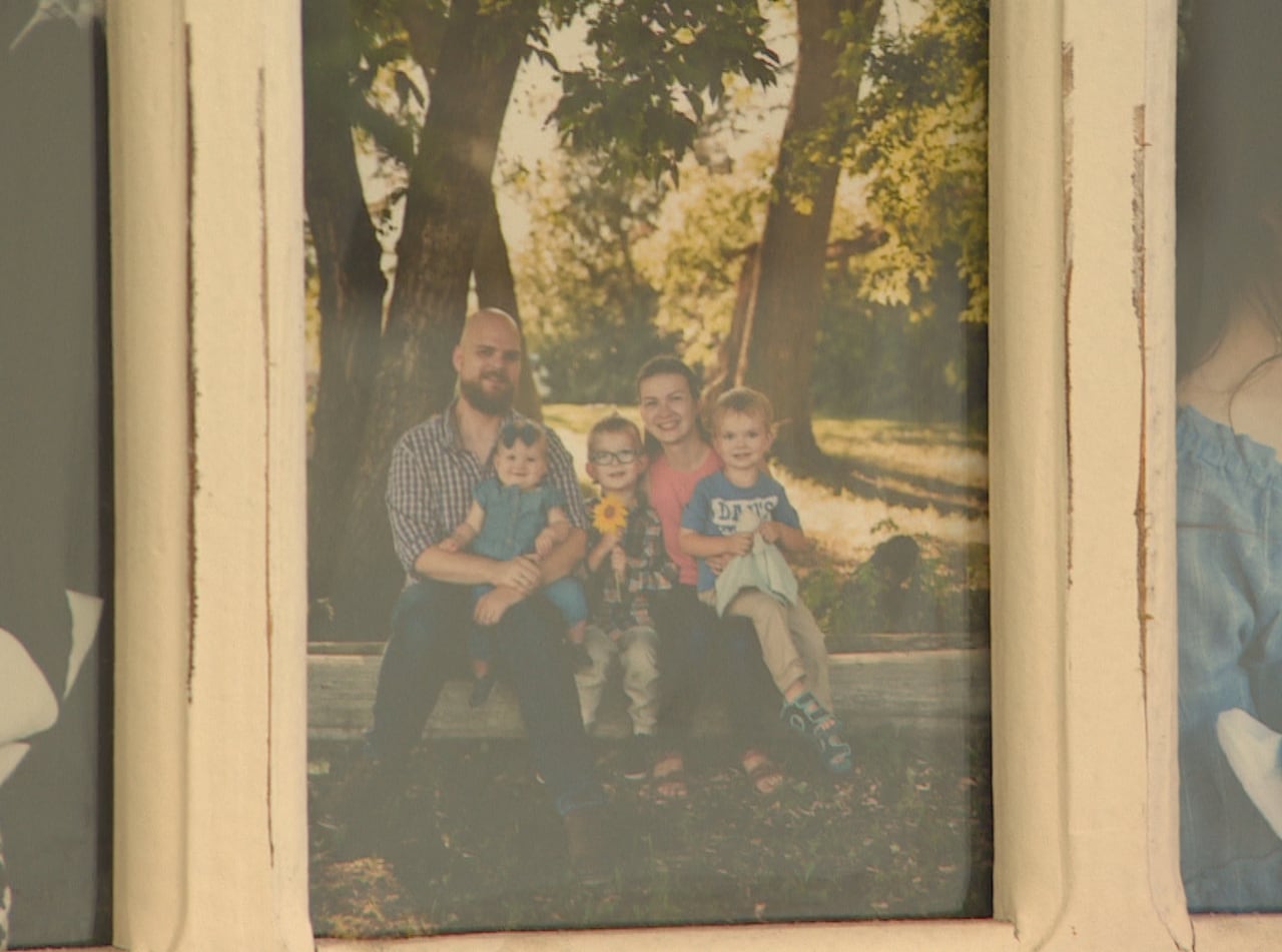A photo of a family in a frame.