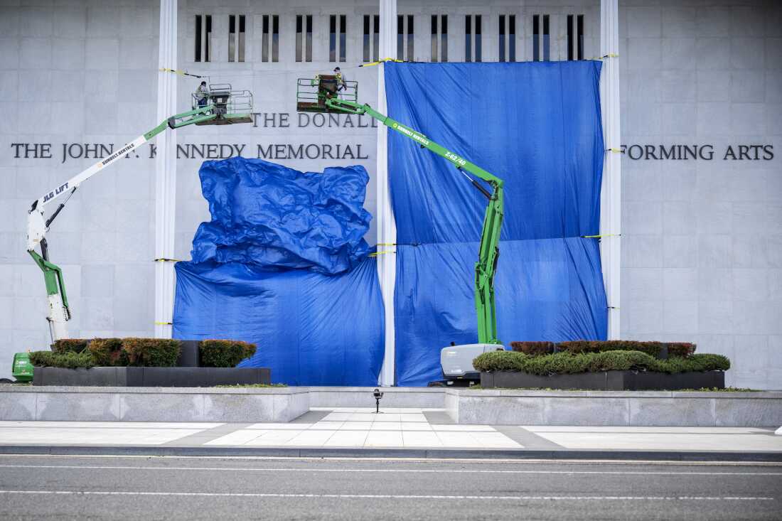 On Sunday, President Trump announced he will close the Kennedy Center in July for two years of renovation. Above, a tarp covers construction on the building's facade on Dec. 19, 2025, after Trump announced The John F. Kennedy Memorial Center for the Performing Arts would be renamed The Trump-Kennedy Center.