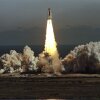 The space shuttle Challenger lifts off from Kennedy Space Center in Florida on January 28, 1986, in a cloud of smoke.