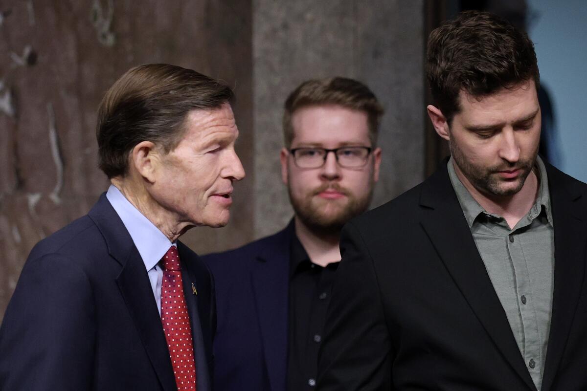 Sen. Richard Blumenthal (D-CT), Luke Ganger and Brent Ganger arrive to a public forum