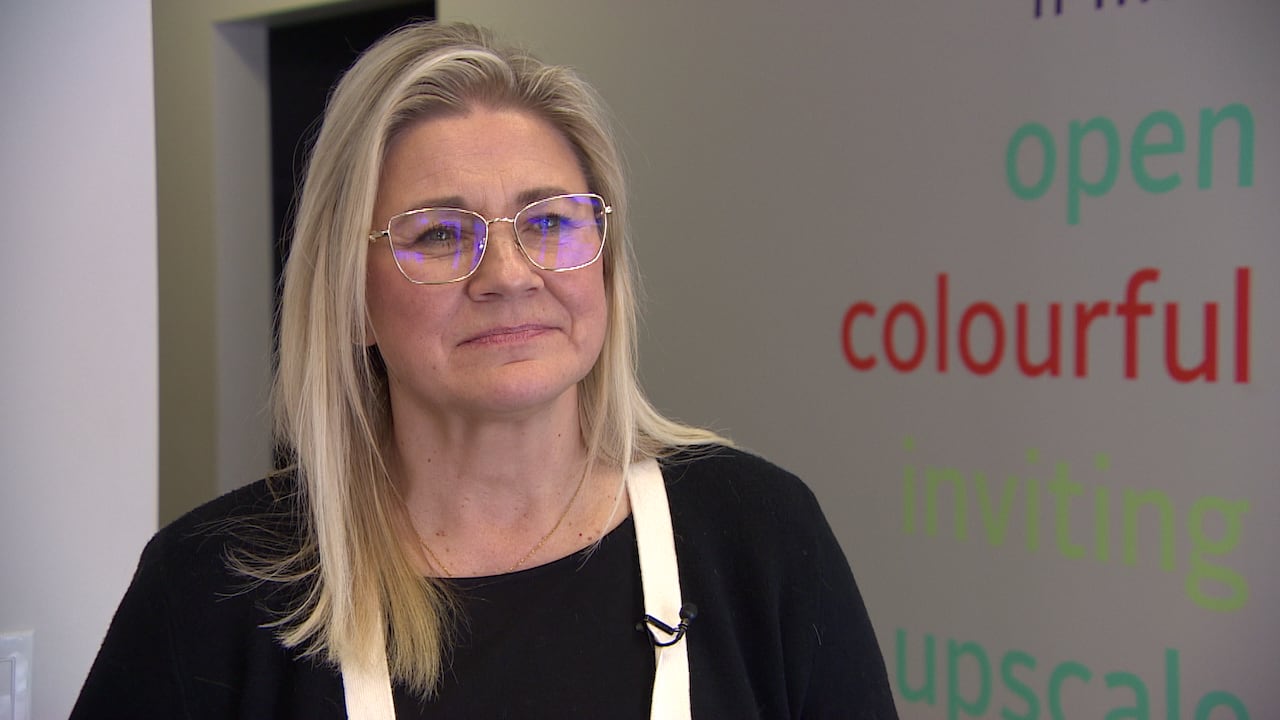 a woman speaks in an interview