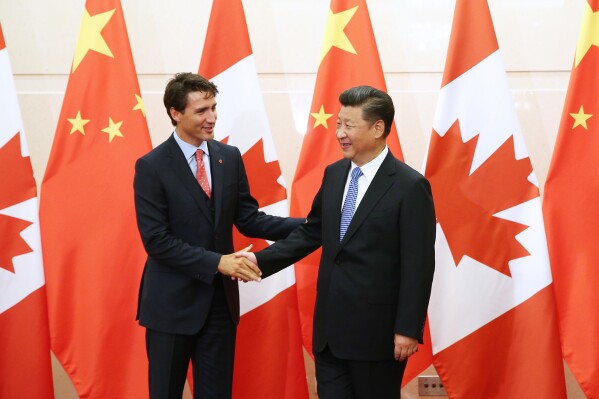 China's President Xi Jinping, right, shakes hands with Canada's Prime Minister Justin Trudeau before their meeting at the Diaoyutai State Guesthouse in Beijing, China, Wednesday, Aug. 31, 2016. (Wu Hong/Pool Photo via AP, File)