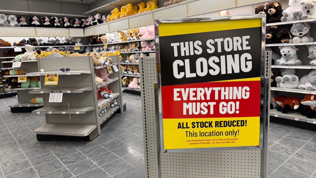 interior of toy store with sign reading This store is closing.
