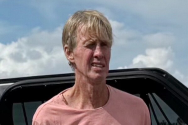 FILE p In this imaged released by the Martin County, Fla., Sheriff's Office, law enforcement officers arrest Ryan Routh, the man suspected in the apparent assassination attempt of Donald Trump, Sept. 15, 2024. (Martin County Sheriff's Office via AP, File)