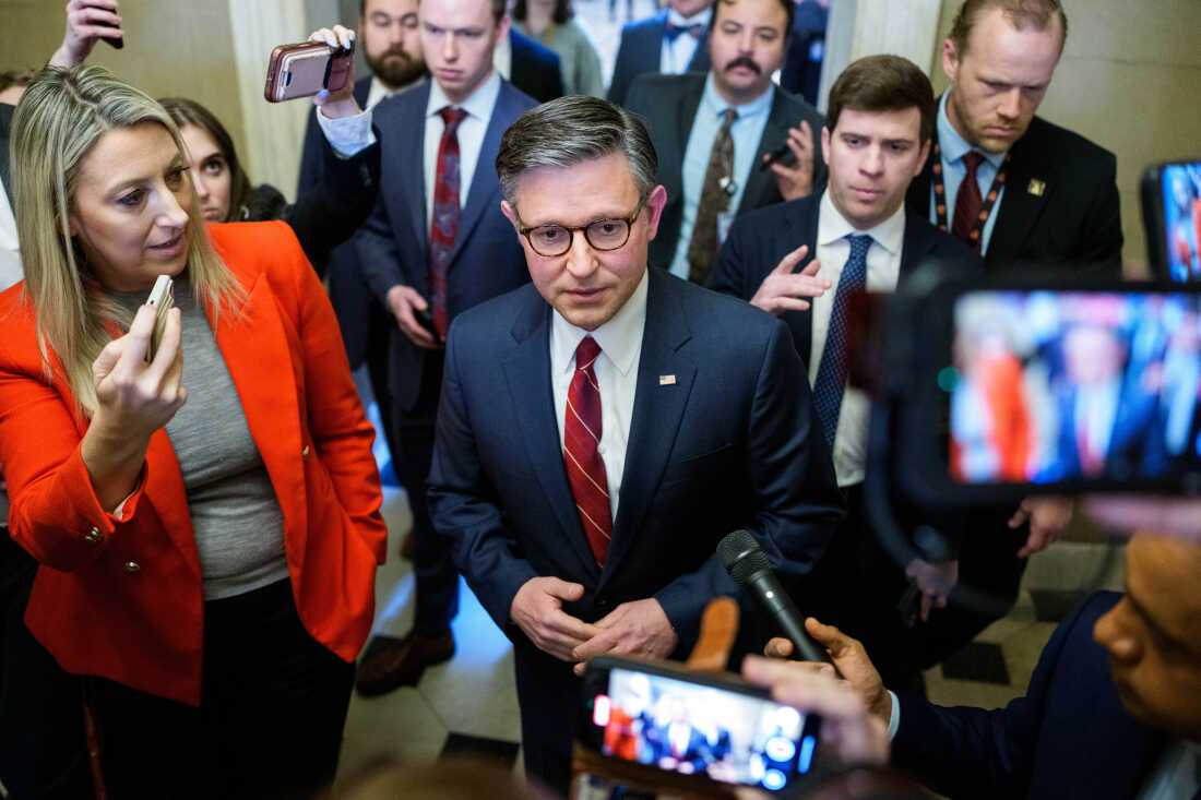 House Speaker Mike Johnson speaks with reporters, who surround him at the U.S. Capitol on February 3.