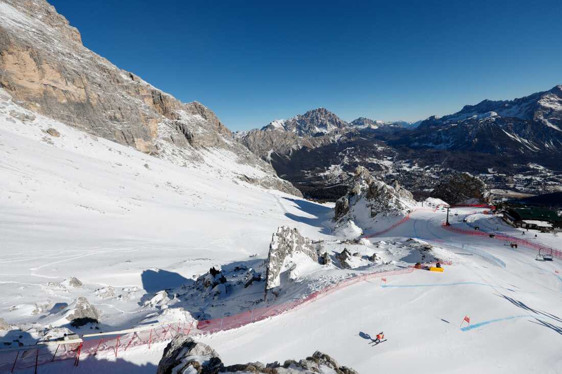 A skier trains in the snow-covered Dolomite Mountains in Cortina d'Ampezzo, Italy.