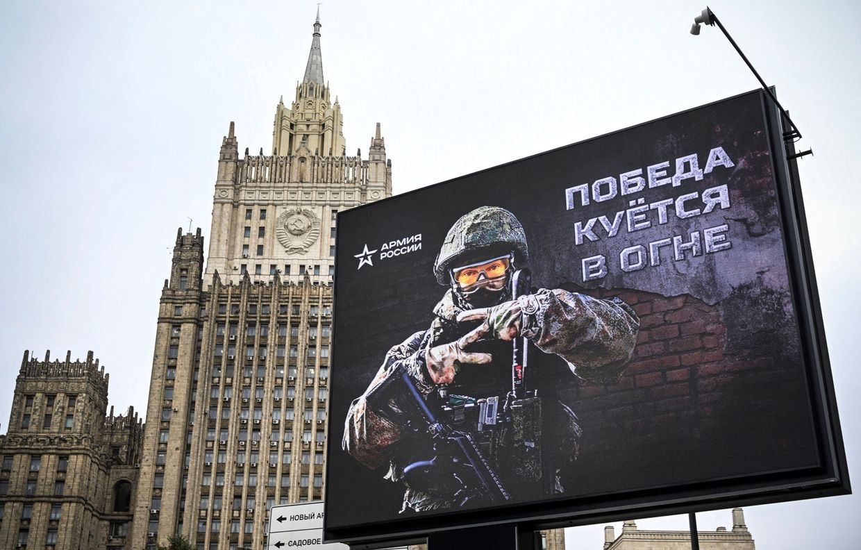 The Russian Foreign Ministry building is seen behind a conscription advertisement billboard displaying the letter Z in central Moscow, Russia, on Oct. 13, 2022.