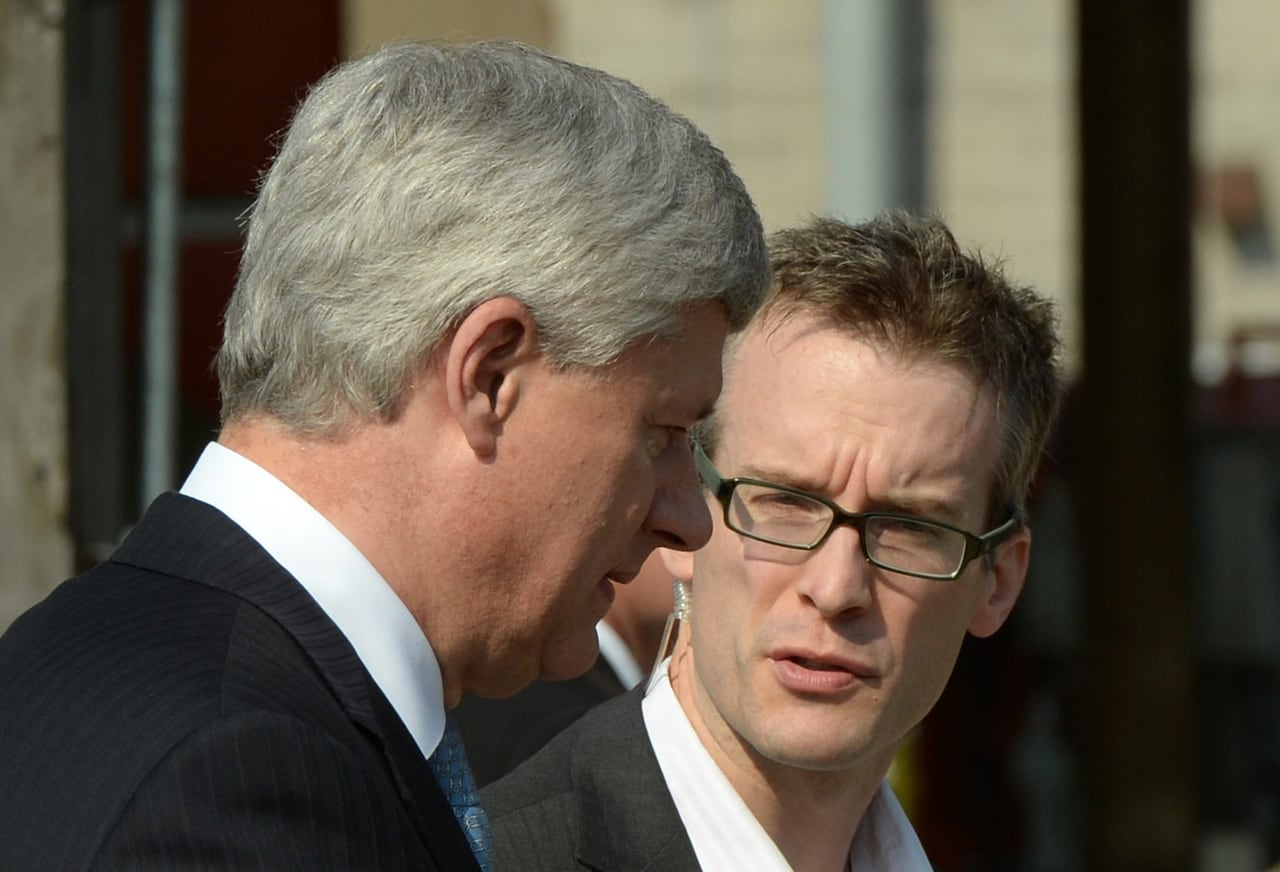 Conservative Leader Stephen Harper talks to chief of staff Ray Novak as he makes a campaign stop at the shipyards in North Vancouver, B.C. on Wednesday, August 12, 2015.