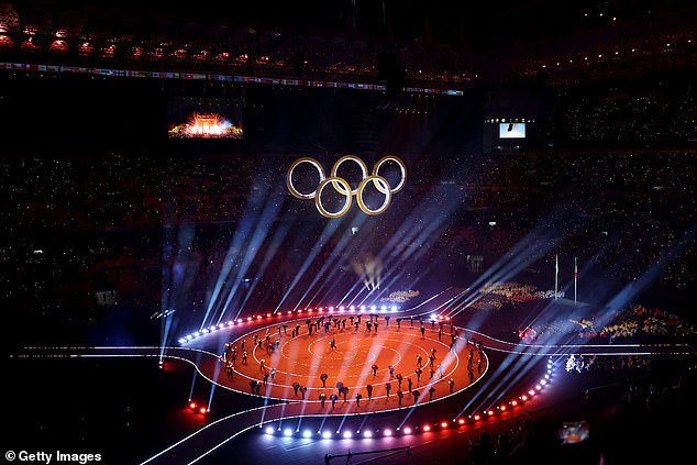 MILAN, ITALY - FEBRUARY 06: A general view as performers represent the lighting of the Olympic cauldrons during the opening ceremony of the Milano Cortina 2026 Winter Olympics at San Siro Stadium on February 06, 2026 in Milan, Italy. (Photo by Maja Hitij/Getty Images)