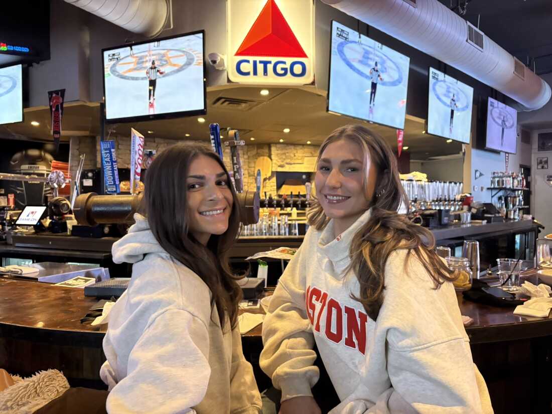 Jenna Freni, 24, (left) and Angel Galiotzakis, 23, spent their childhood celebrating Patriots Superbowl championships. Sharing drinks at the Game On! sports bar in Boston, they’re hoping this is the year New England starts winning again. “We’ve suffered enough,” Galiotzakis smiles.