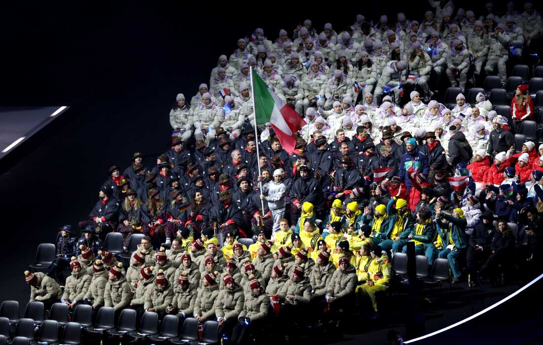 Athletes in Milan finished their Parade of Nations route at rows of seats just offstage.