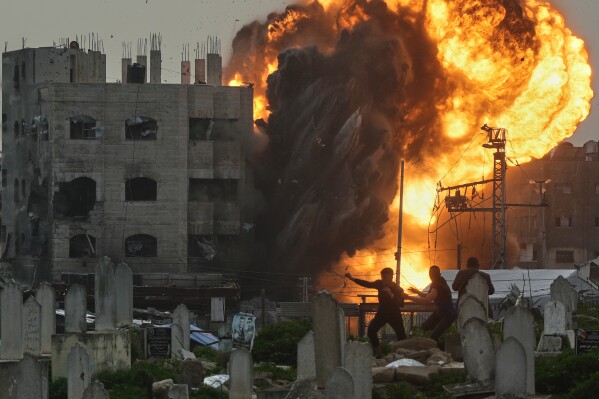 Smoke and flames rise from an Israeli military strike on a building in the Zeitoun neighborhood of Gaza City, Friday, Feb. 6, 2026. (AP Photo/Jehad Alshrafi)