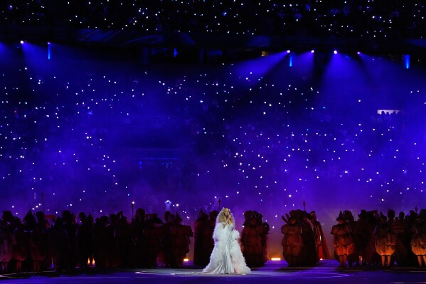Singer Mariah Carey performs during the Olympic opening ceremony at the 2026 Winter Olympics, in Milan, Italy, Friday, Feb. 6, 2026. (AP Photo/Ashley Landis)
