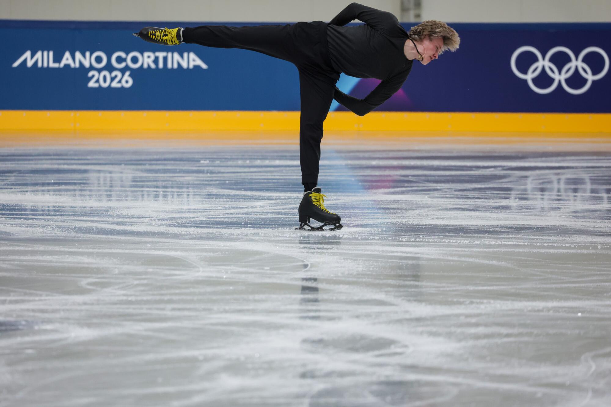 Ilia Malinin skates on ice.
