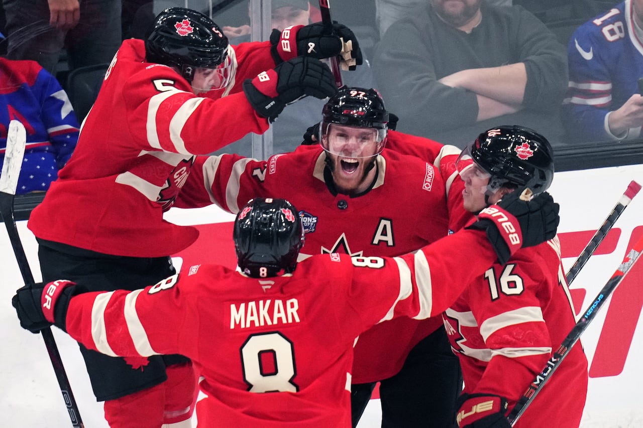 Team Canada's Connor McDavid (97) celebrates after his game-winning goal against the United States