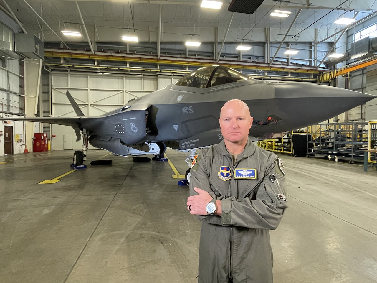 U.S. Brig. Gen. David Berkland, who commands Luke Air Force Base in Glendale, Ariz., stands in front of an F-35.