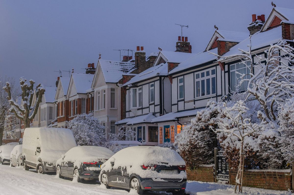 Snow in London street at dawn
