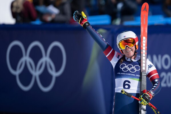 Breezy Johnson of the United States reacts in the finish area of the alpine ski women's downhill race, at the 2026 Winter Olympics, in Cortina d'Ampezzo, Italy, Sunday, Feb. 8, 2026. (Jean-Christophe Bott, Keystone via AP)