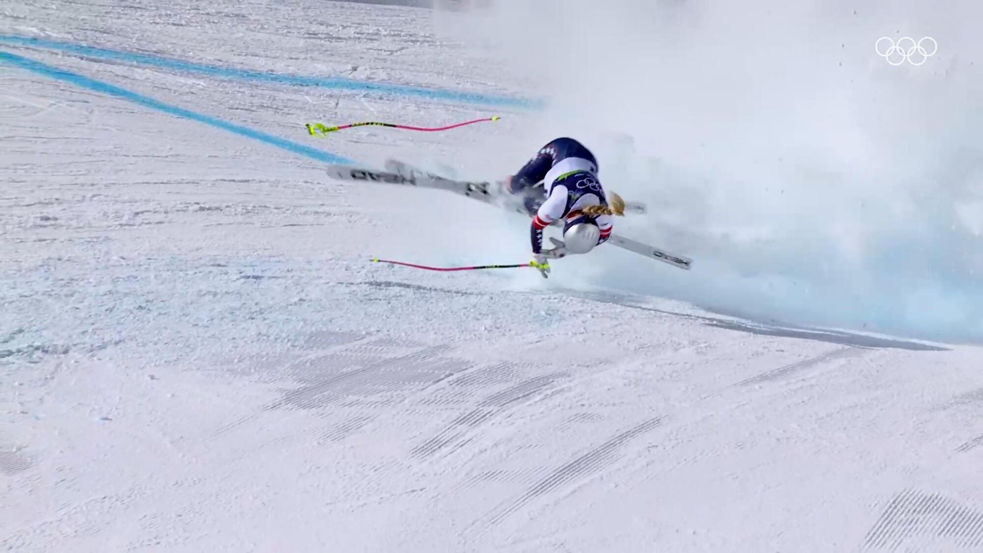 American Lindsey Vonn crashes into a gate during an alpine ski downhill race at the Winter Olympics.