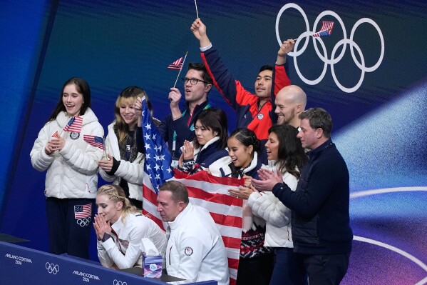 Amber Glenn of the United States reacts to her scores after competing during the figure skating women's team event at the 2026 Winter Olympics, in Milan, Italy, Sunday, Feb. 8, 2026. (AP Photo/Natacha Pisarenko)