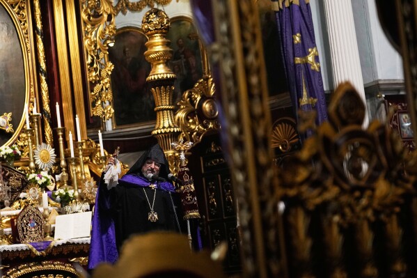 Archbishop Sahak II Mashalian, Armenian Patriarch of Constantinople, leads Sunday Mass at the Surp Asdvadzadzin Patriarchal Church in Istanbul, Turkey, Sunday, Nov. 23, 2025, ahead of the visit of Pope Leo XIV to Turkey. (AP Photo/Khalil Hamra)