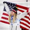 ZHANGJIAKOU, CHINA - FEBRUARY 08: Bronze medallist, Jessie Diggins of Team United States celebrates with a flag during the Women's Cross-Country Sprint Free Final flower ceremony on Day 4 of the Beijing 2022 Winter Olympic Games at The National Cross-Country Skiing Centre on February 08, 2022 in Zhangjiakou, China. (Photo by Matthias Hangst/Getty Images)