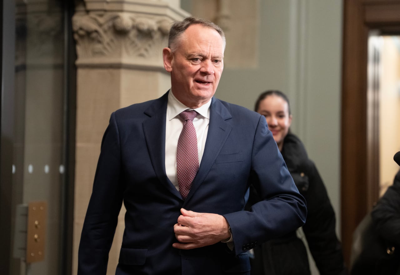 A man in a suit walking.