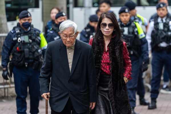Retired Chinese cardinal Joseph Zen Ze-Kiun, left, and Jimmy Lai's wife Teresa Lai arrive at the West Kowloon Magistrates' Courts ahead of the sentencing for former Hong Kong publisher Jimmy Lai n Hong Kong, Monday, Feb. 9, 2026. (AP Photo/Chan Long Hei)