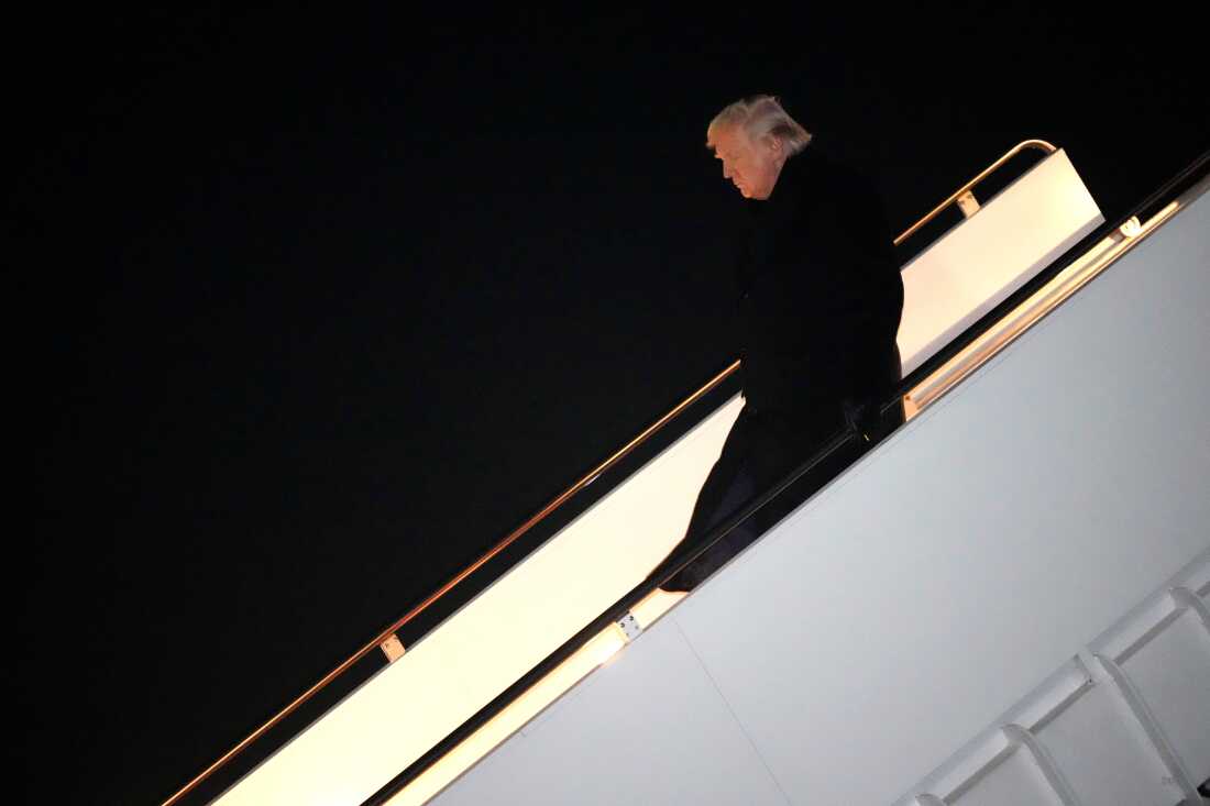 President Donald Trump steps off Air Force One, early Monday, Feb. 9, 2026, at Joint Base Andrews, Md., after returning from a trip to Florida.