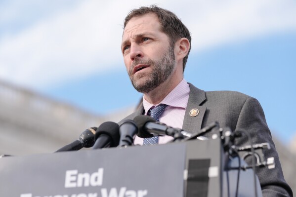 FILE - Rep. Jason Crow, D-Colo., speaks during a news conference on the Venezuela War Powers Resolution on Capitol Hill, Jan. 22, 2026, in Washington. (AP Photo/Mariam Zuhaib)