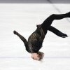 Ilia Malinin lands a backflip in his free skate in the team event on Sunday. 