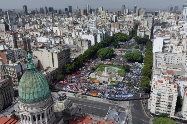Unions and opposition supporters protest a labor reform bill proposed by President Javier Milei's government outside Congress in Buenos Aires, Argentina, Wednesday, Feb. 11, 2026. (AP Photo/Rodrigo Abd)