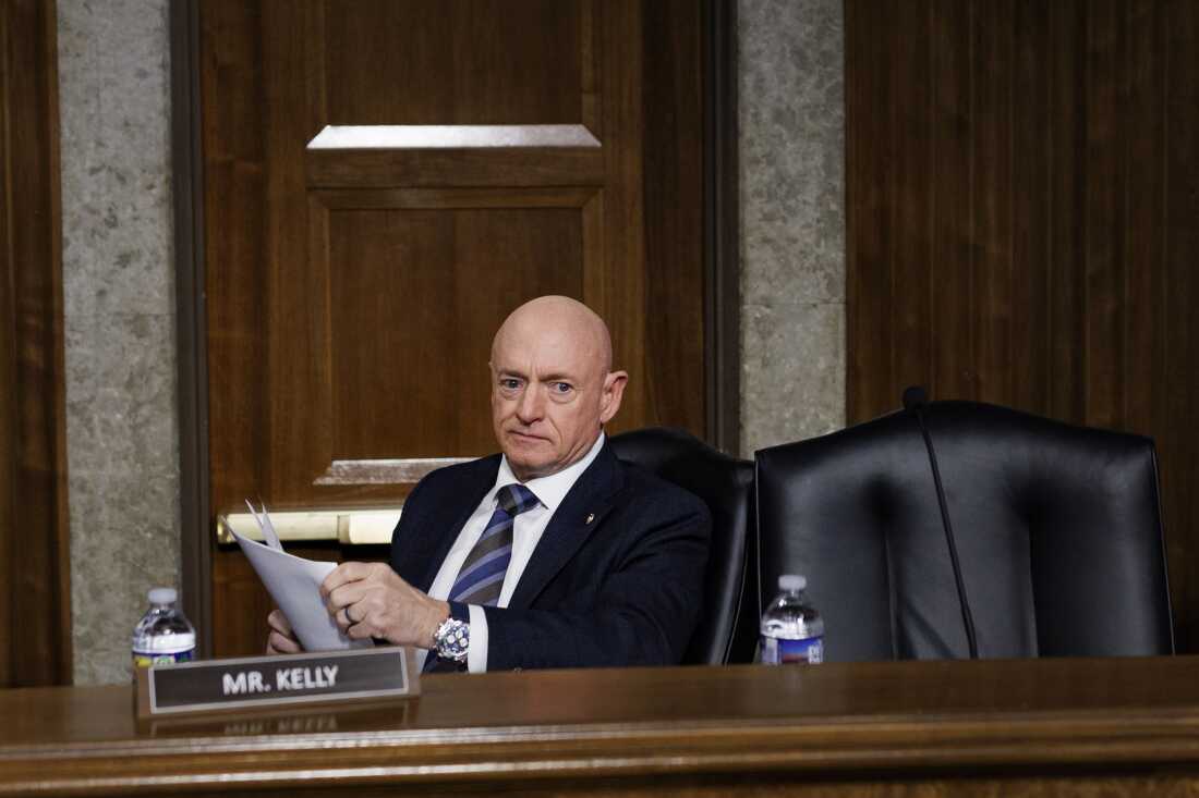 Sen. Mark Kelly, D-Ariz., takes his seat during a Senate Armed Services Committee hearing on January 15.