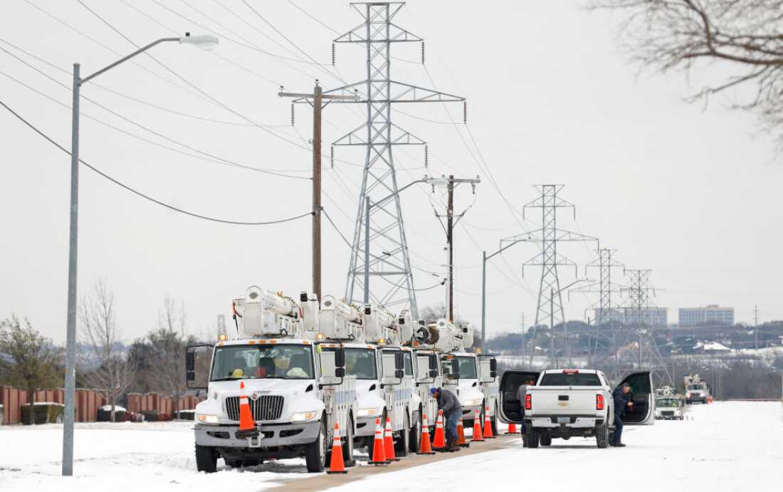 FORT WORTH, TX - FEBRUARY 16: Pike Electric service trucks line up after a snow storm on February 16, 2021 in Fort Worth, Texas. Winter storm Uri has brought historic cold weather and power outages to Texas as storms have swept across 26 states with a mix of freezing temperatures and precipitation.
