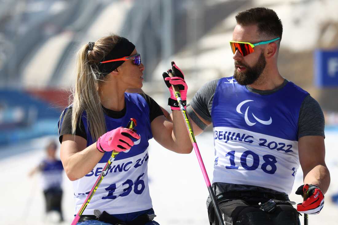 Oksana Masters and Aaron Pike at the Beijing 2022 Winter Paralympics. They bonded at a Para Nordic competition in 2013 over their love of coffee.