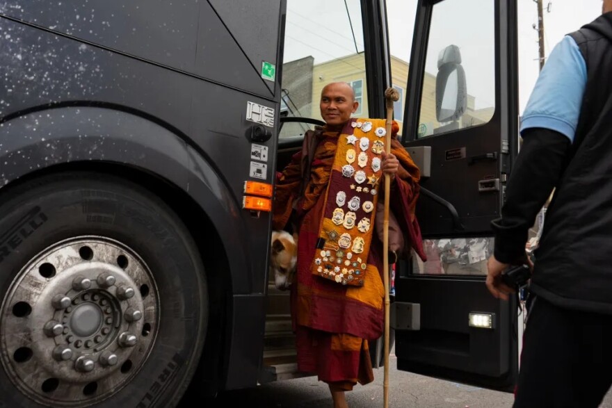Rev. Nguyen is the first monk to step off the bus in front of Eastover Park.