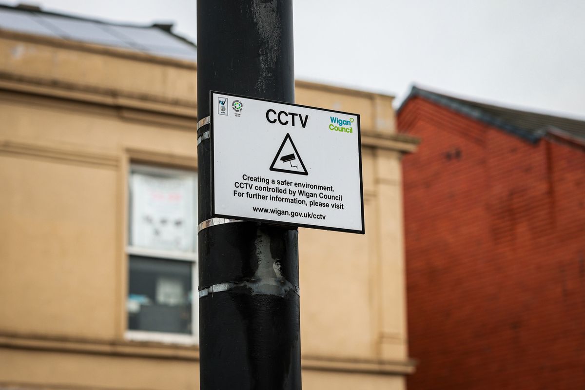 Signs warn that CCTV is in place in the area
