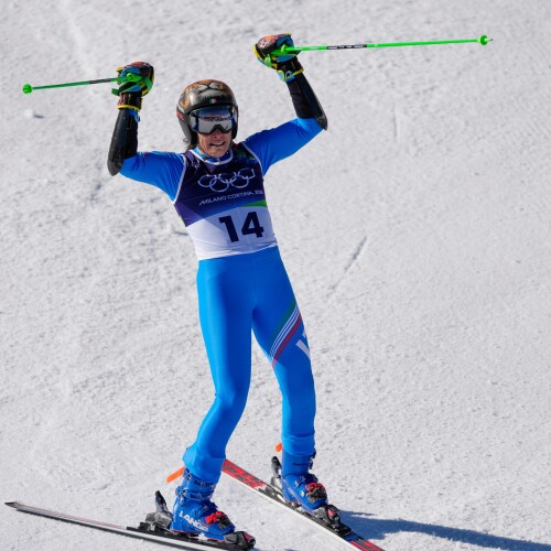 Italy's Federica Brignone celebrates at the finish area of an alpine ski, women's giant slalom race, at the 2026 Winter Olympics, in Cortina d'Ampezzo, Italy, Sunday, Feb. 15, 2026. (AP Photo/Andy Wong)