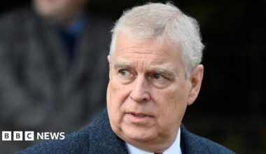 Andrew Mountbatten-Windsor attends the Royal Family's Christmas Day service at St. Mary Magdalene's church, as the Royals take residence at the Sandringham estate in eastern England. He has short grey hair and is wearing a dark overcoat and white shirt