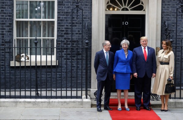 Britain's Prime Minister Theresa May and her husband Philip greet President Donald Trump and first lady Melania outside 10 Downing Street in central London, Tuesday, June 4, 2019. (AP Photo/Kirsty Wigglesworth, File)