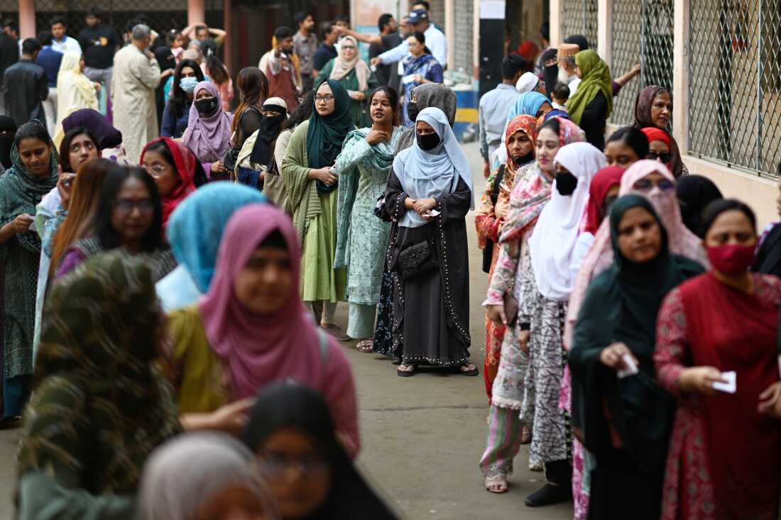 Women queue up to cast their vote at a polling station during Bangladesh's national parliamentary election, in Dhaka, Bangladesh, Thursday, Feb. 12, 2026.