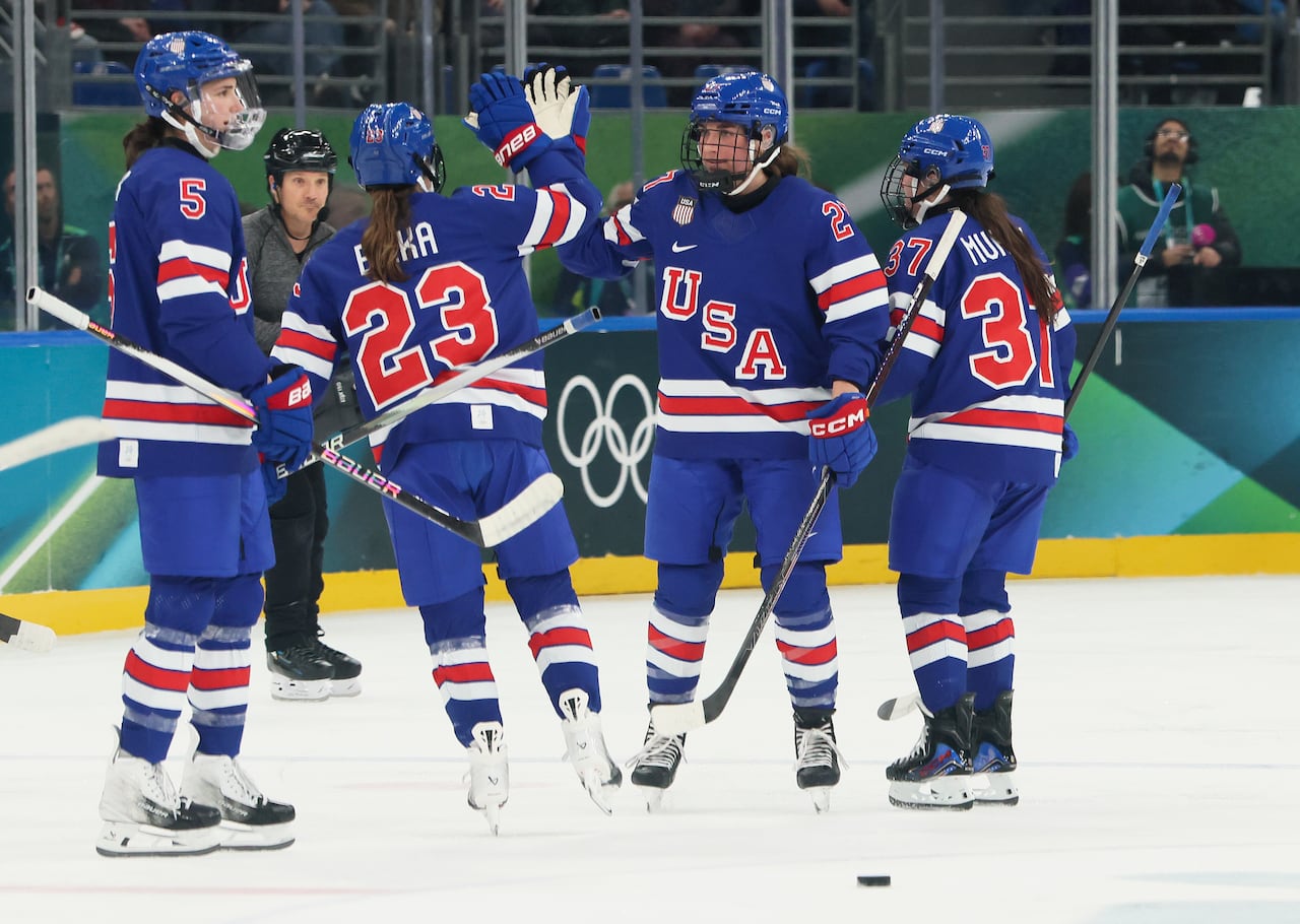 Four U.S. female hockey players.