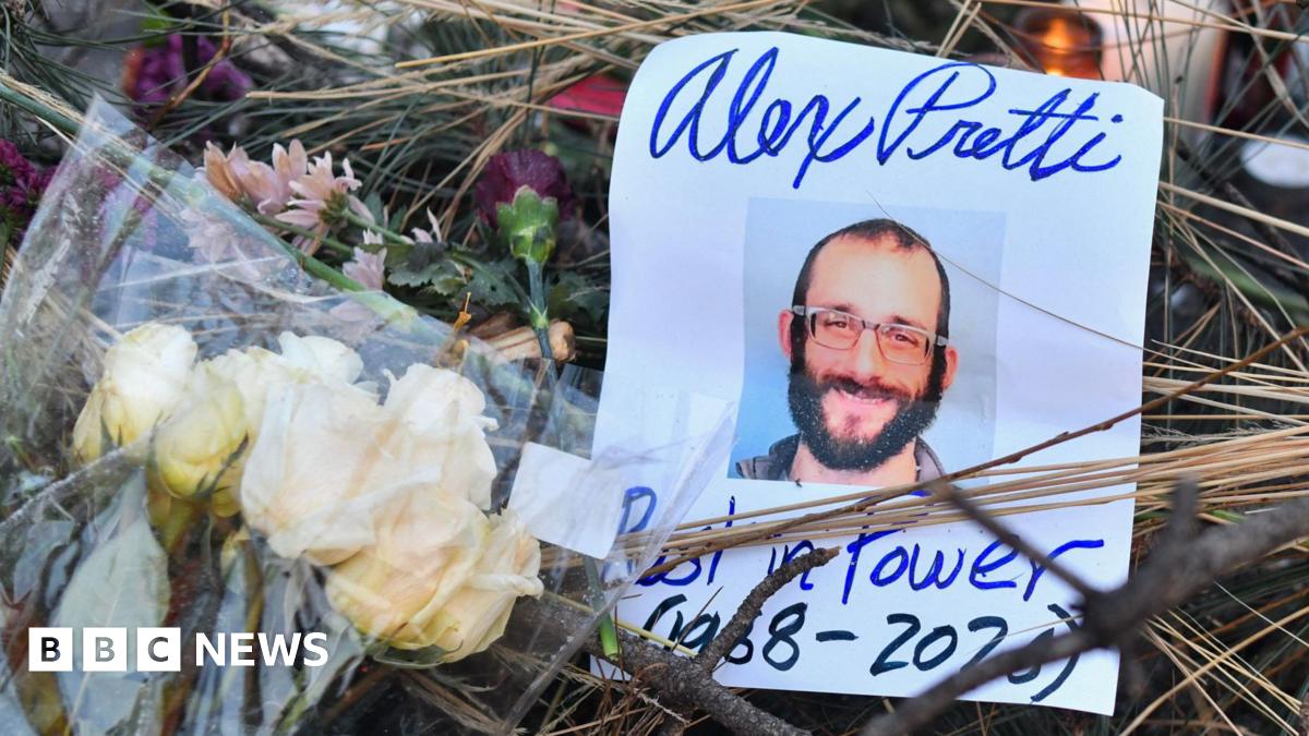 Flowers are left at a makeshift memorial in the area where Alex Pretti was shot dead a day earlier by federal immigration agents in Minneapolis, Minnesota, on January 25, 2026.