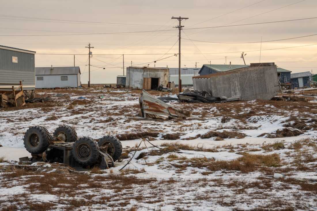 A building and an ATV are overturned in Kwigillingok, Alaska in October 2025.