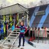 U.S. cross-country ski team coach Matt Whitcomb with Yolanda the wax truck and some of the 600 pairs of skis it holds at a World Cup race in Goms, Switzerland Jan. 23, 2026