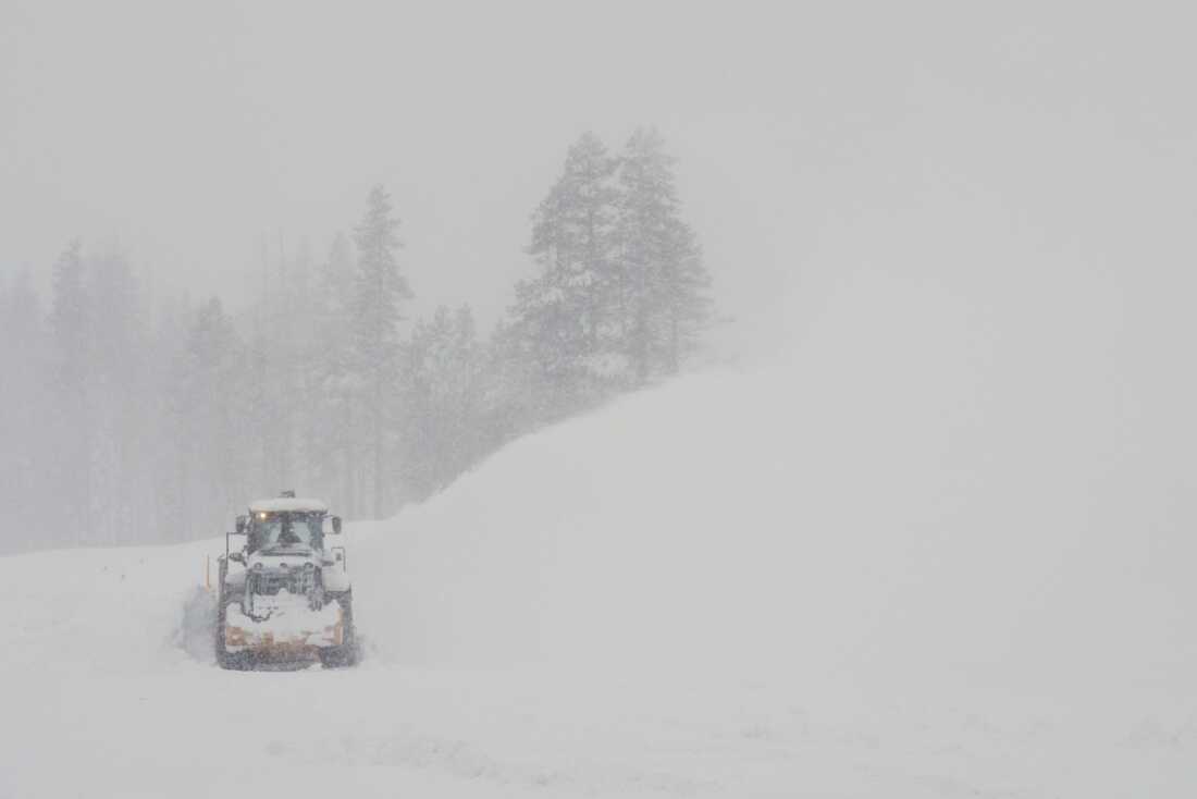 A road is cleared during a snow storm on Wednesday, Feb. 18, 2026 near Soda Springs, Calif.