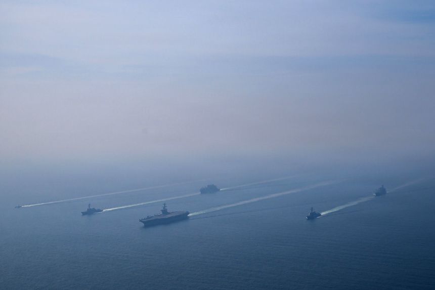 The aircraft carrier USS Abraham Lincoln and other vessels sail in formation in the Arabian Sea, on February 6, 2026.